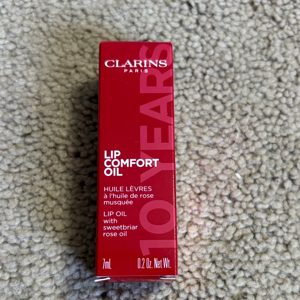 Clarins Lip Comfort Oil in Vibrant Red Packaging